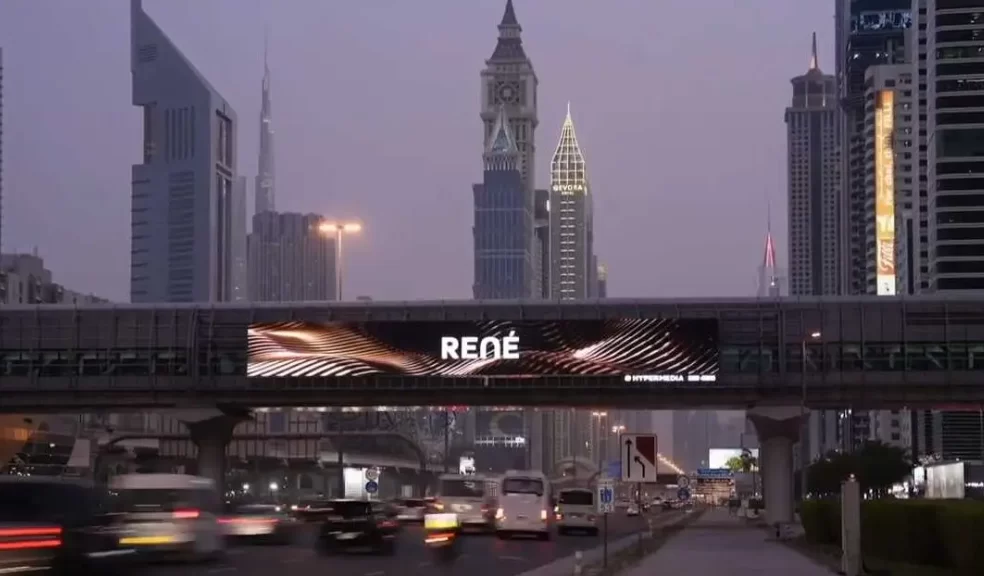 Illuminated storefront signs and pylon signs along Sheikh Zayed Road in Dubai