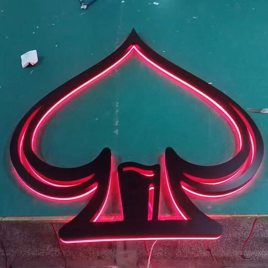 Custom matte black backlit logo — painted stainless steel spade sign with red LED neon outline, Hongbo Signage factory