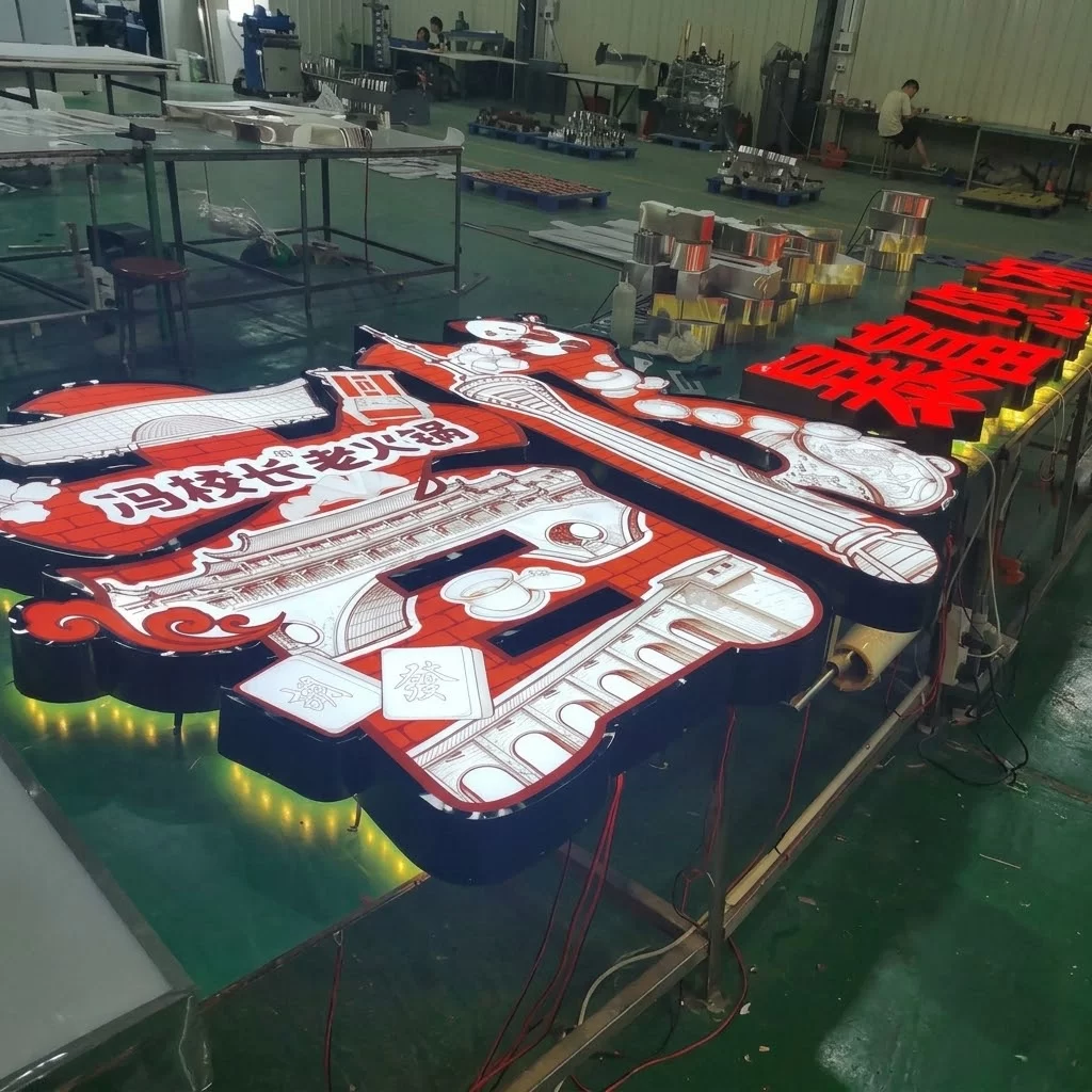 Custom brushed black steel standoff double-sided illuminated channel letters on the Hongbo Signage production floor